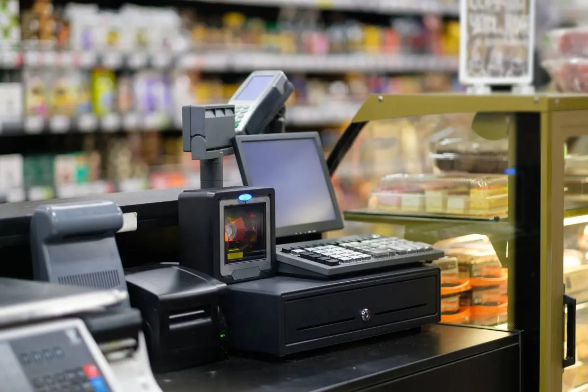 hardware pos system in convenience store with cash register and barcode scanner