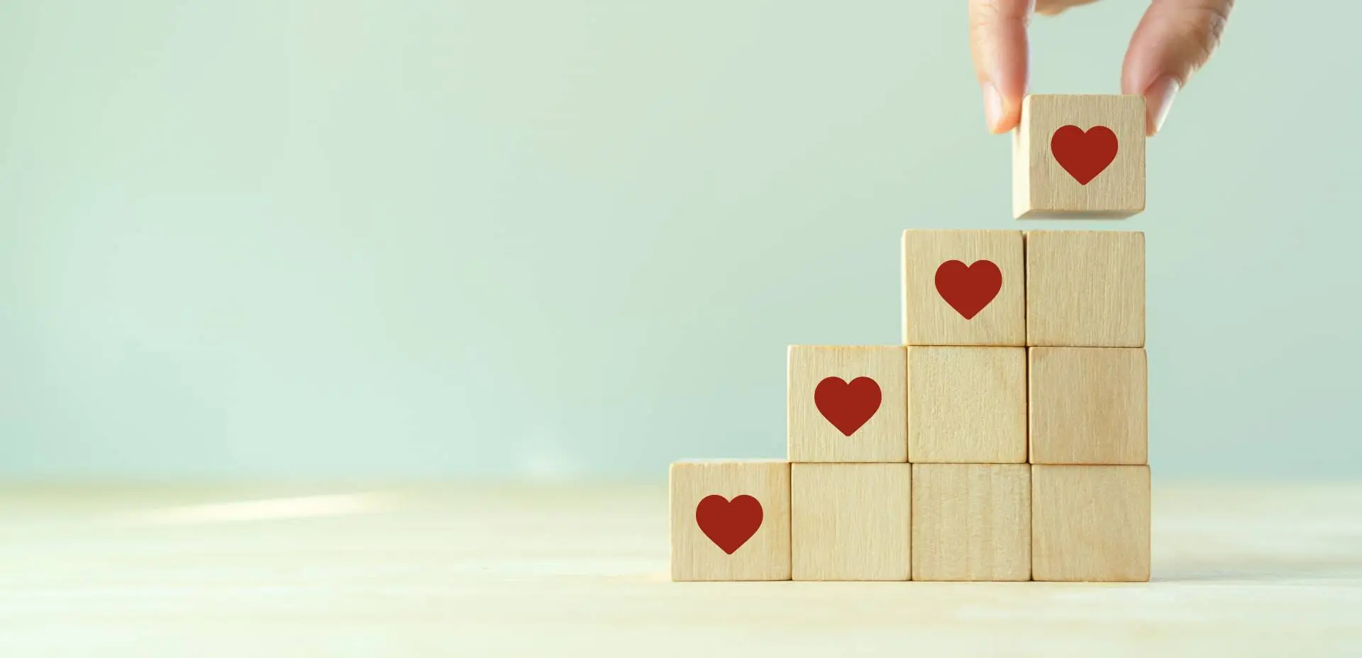 building blocks with hearts demonstrating growth of customer loyalty programs